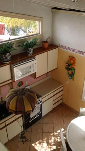a small kitchen with a stove and a window at Amazingly Romantic Vacation for Your Honeymoon in Tijuana