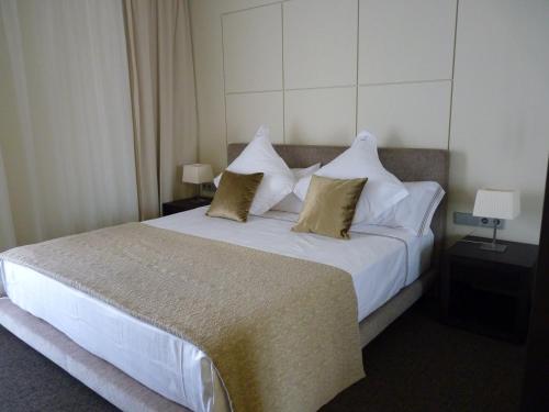 Letto o letti in una camera di Cosmopolita Hotel Boutique & Spa