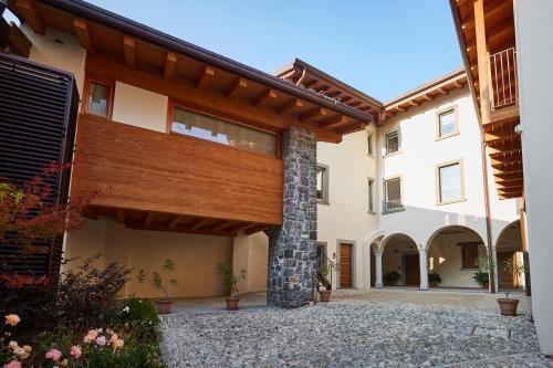 an exterior view of a house with a wooden roof at Palazzo Eleonora in Monasterolo del Castello