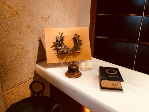 a picture of a painting on top of a desk at Hotel Olympia Palace in Olympia