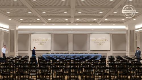 セインツ・コンスタンティン＆ヘレナにあるAstor Garden Hotelの中央に椅子とテーブルが備わる部屋