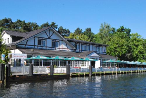 a building with a restaurant on the water at Neu-Helgoland in Berlin