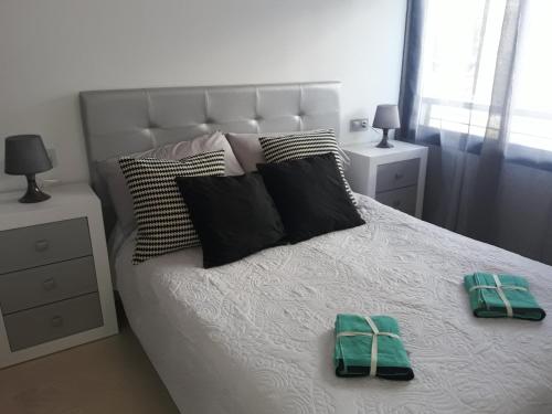 Posteľ alebo postele v izbe v ubytovaní Apartamento Castillo Bajo