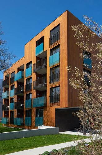 a brick building with balconies on the side of it at APPADU Appartements in St. Gallen