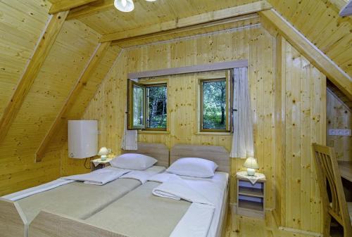 A bed or beds in a room at Chalets Bogo & Neno