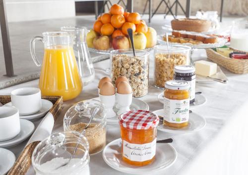a table with many jars of food on it at Castello di Gabiano in Gabiano