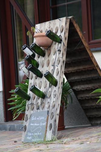 a bunch of wine bottles on a wall at Weingut Sauer-Kettermann in Enkirch