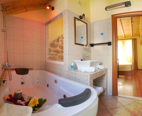 a bathroom with a tub and a sink at Authentic Luxury Rooms in Split