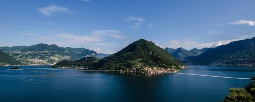 a view of a large body of water with mountains at Locanda La Pernice in Sulzano