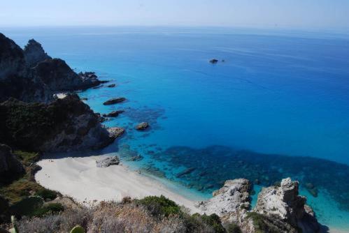 an aerial view of a beach and the ocean at Sunshine Club Hotel Centro Benessere in Ricadi