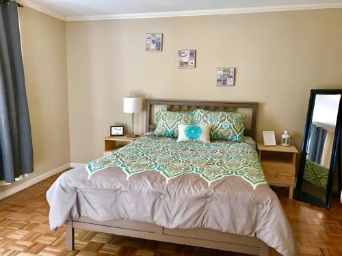 a bedroom with a bed with blue pillows at Downtown 1 Bedroom Apt 20L in Atlanta