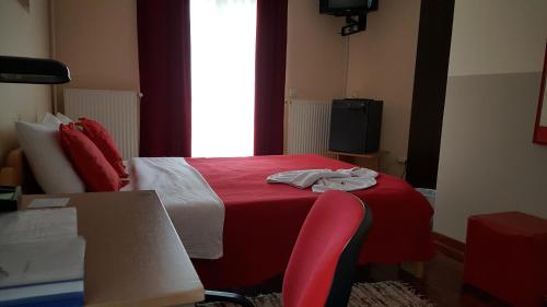 Ein Bett oder Betten in einem Zimmer der Unterkunft Garni Hotel Lama