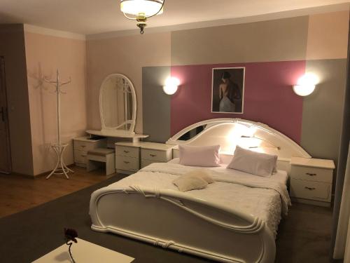 Un pat sau paturi într-o cameră la Hotel Passione
