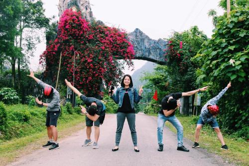 a group of people standing on a road at Carambola Bungalow in Phong Nha