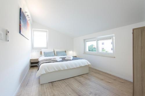 Postel nebo postele na pokoji v ubytování Apartment L