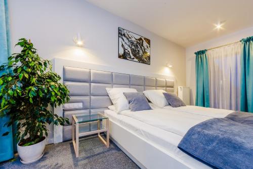 En eller flere senge i et værelse på Zigzak Apartments Superior 10B
