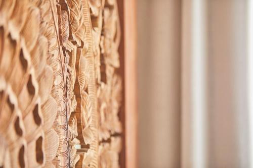 a close up of a wooden wall with patterns on it at Puro Hotel Oasis Urbano in Palma de Mallorca