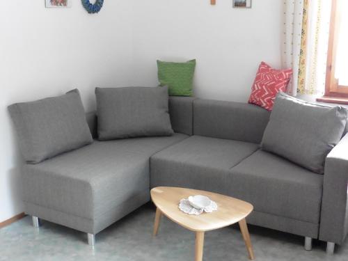 a living room with a couch and a table at Hilde in Lungötz