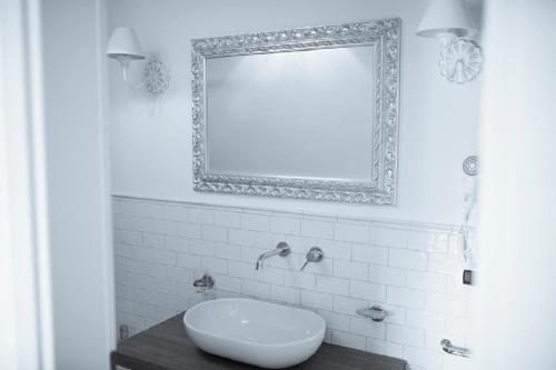 a bathroom with a sink and a mirror at Hotel Villa Delle Meraviglie in Maratea