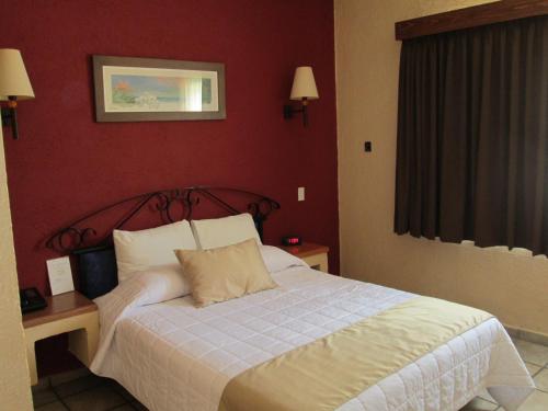 Cama o camas de una habitación en Estancia Real Los Cabos