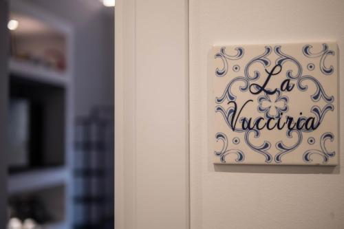 a door with a sign that reads la merla at Family Affair Luxury Rooms&Suites in Palermo