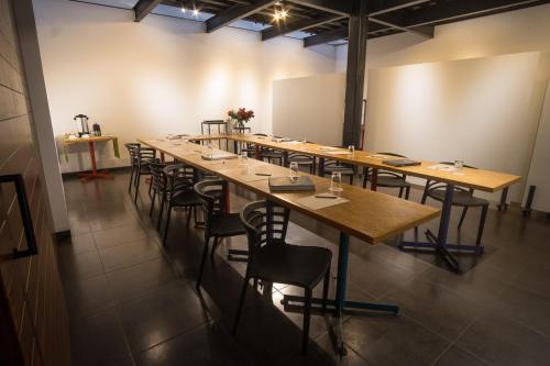 a large room with a long table and chairs at Casa Q in Quito