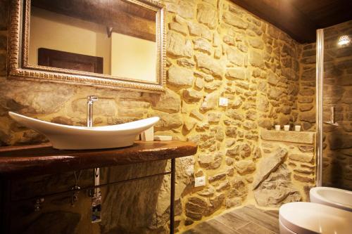 a bathroom with a sink and a mirror at Canto del Fiume in Ortignano Raggiolo