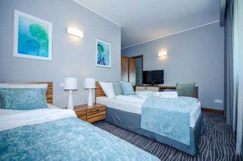 Säng eller sängar i ett rum på Hotel Active
