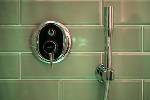 a shower with a shower head in a bathroom at Family Affair Luxury Rooms&Suites in Palermo