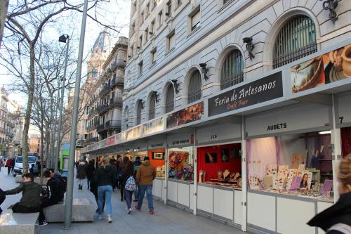 a group of people walking in front of a store at Pensión Arosa in Barcelona