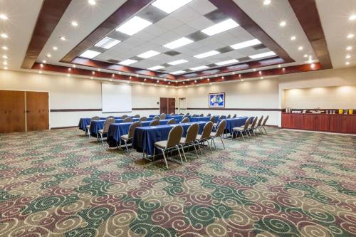 a conference room with tables and chairs in it at Wyndham Garden Monterrey Norte in Monterrey