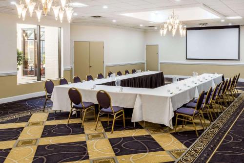 a large conference room with a long table and chairs at Wyndham Garden Greensboro in Greensboro