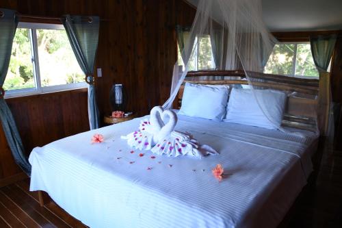 Una cama o camas en una habitación de Vanilla Hills Resort