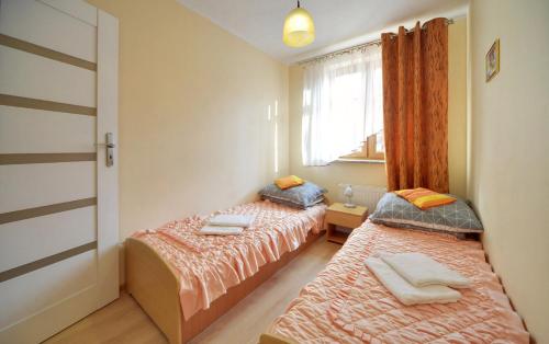Posteľ alebo postele v izbe v ubytovaní Apartamenty "MILENA"