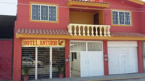 a red building with a hotel antelope at Hotel Anturio in Huajuapan de León