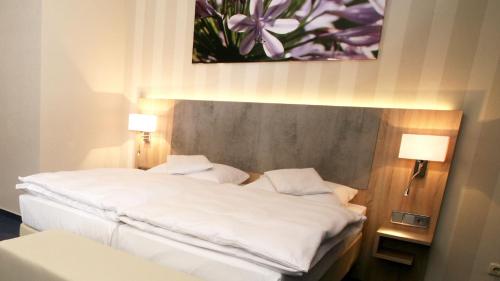 Katil atau katil-katil dalam bilik di Nigel Restaurant & Hotel im Wendland