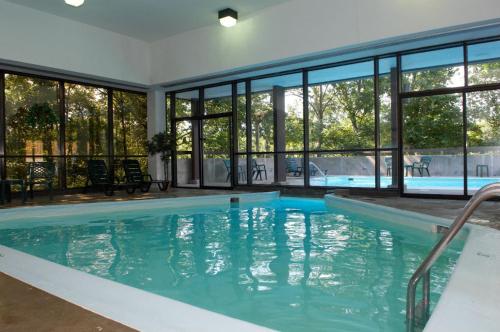 a swimming pool with a large tub in the middle of it at Spring Mill Inn in Mitchell