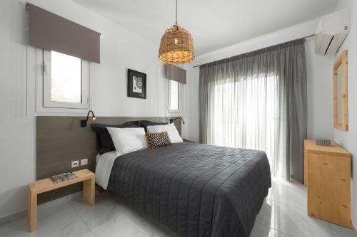 
A bed or beds in a room at L & C Boutique Apartments
