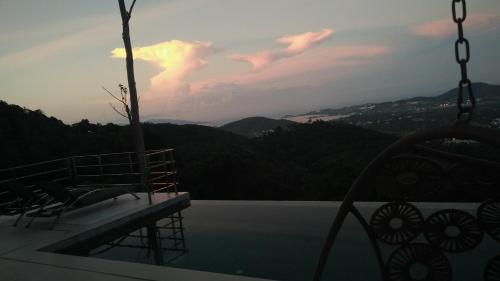 a balcony of a house with a view of the mountains at Perfect Sea View Mountain Villa Koh Samui in Chaweng