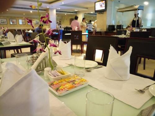 a table with a plate of food on it at Hampshire Plaza in Hyderabad