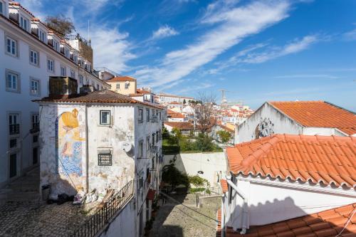 a view of a city from the top of a building at Alfama Loft Studio Loft Apartment w/ River View - by LU Holidays in Lisbon