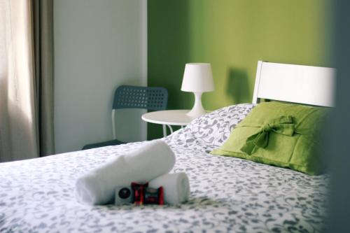 a room with a bed with a camera on it at Nonna Francesca in Patti