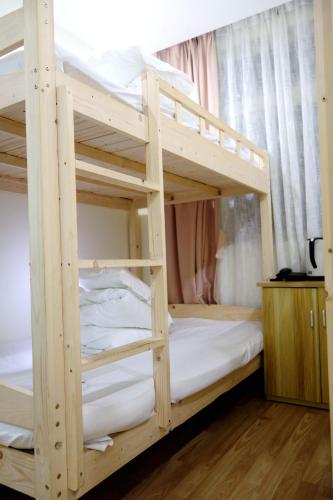 a couple of bunk beds in a room at Hangzhou Memory Travel International Hotel-Edge Westlake in Hangzhou