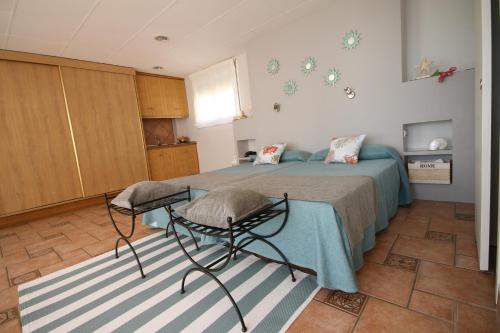 a bedroom with a bed and a table at Hotel Moon Dreams Mediterráneo in Torremolinos