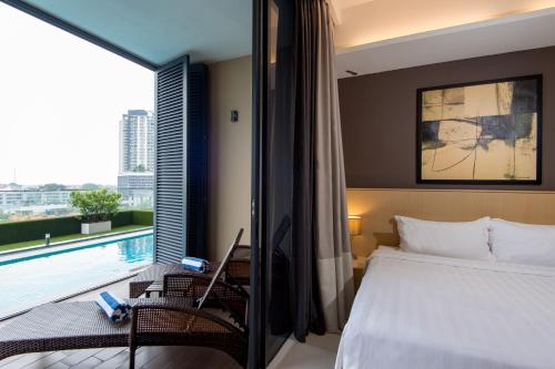 Ένα ή περισσότερα κρεβάτια σε δωμάτιο στο The Pines Melaka