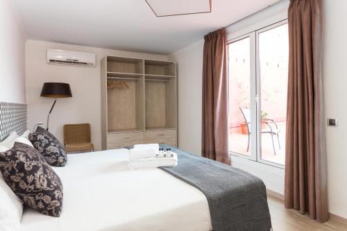 Ένα ή περισσότερα κρεβάτια σε δωμάτιο στο Quartprimera Apartments