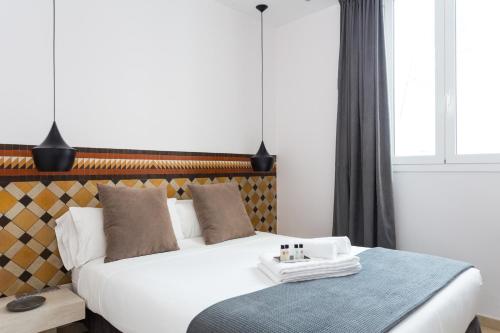 Ένα ή περισσότερα κρεβάτια σε δωμάτιο στο Quartprimera Apartments