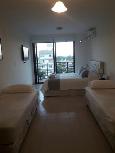 Llit o llits en una habitació de Estudio 9 de Julio