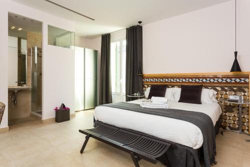Ένα ή περισσότερα κρεβάτια σε δωμάτιο στο Quartprimera Apartments