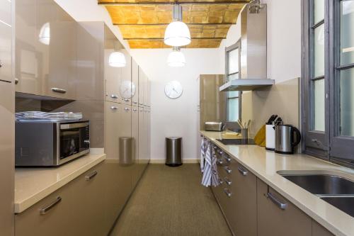 Η κουζίνα ή μικρή κουζίνα στο Quartprimera Apartments